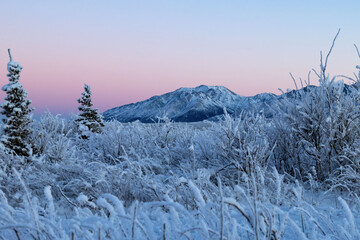 Pink sky over mountains in Alaska