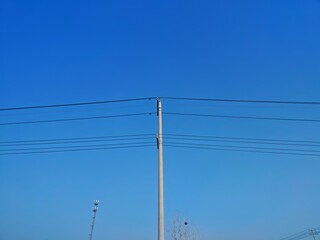 The beauty of power lines under the blue sky