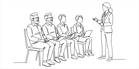 A group of company employees sit in a row during a meeting, attentively listening as a woman leader speaks, guiding the discussion with authority and insight.

