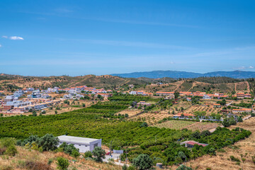 Fototapeta premium Silves countryside view of green fields, hills and houses Algarve southern Portugal