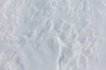 The snow is white and the ground is covered in it