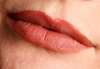 A woman's lips are painted red
