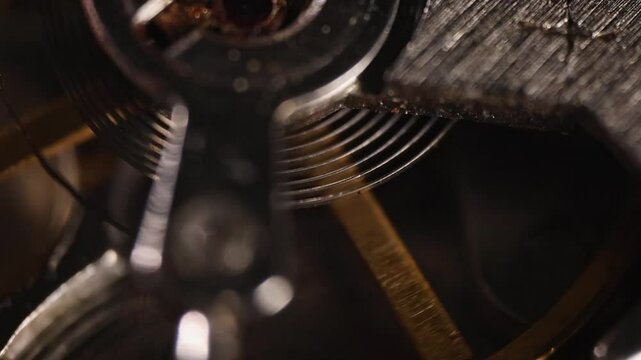 Slow-motion pendulum movement in a wristwatch mechanism, extreme macro video