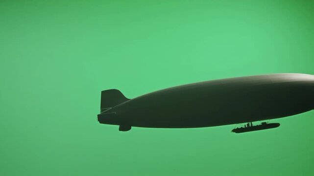 Dark silhouette zeppelin airship gliding against green screen background, providing clean alpha channel for seamless compositing and professional visual effect integration
