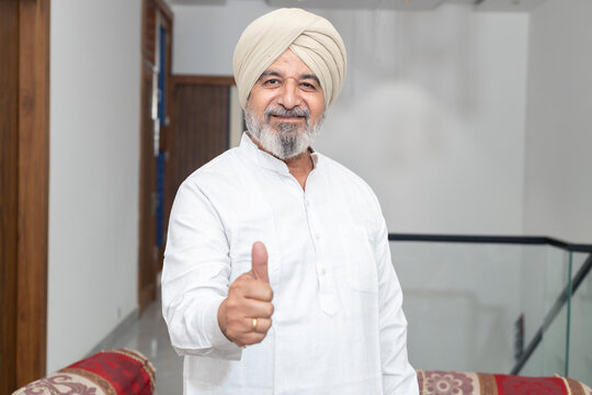 Senior Indian sikh man wearing turban do thumbs up, People of punjab, Religion or Sikhism in india.