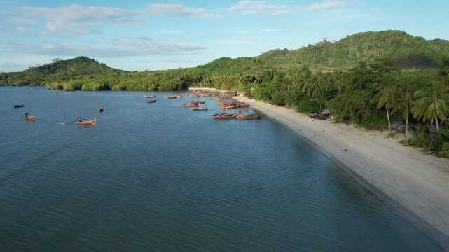 Aerial view of Andaman sea and long tail boat in Koh Mook, Thailand