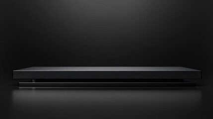 Minimalist black platform design against dark background