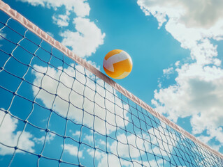 Volleyball ball above volleyball net under summer sky