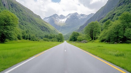 Fototapeta premium Scenic mountain road through lush valley