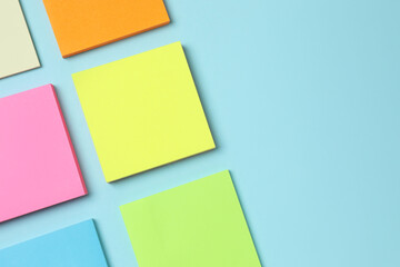 Multicolored paper stickers on a color background