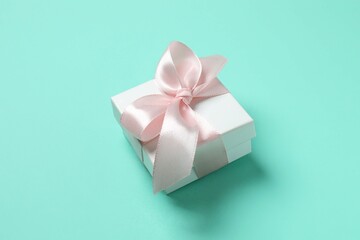 Beautiful gift box on color background