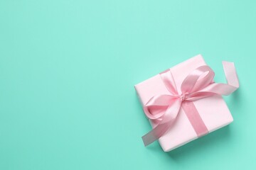Beautiful gift box on color background