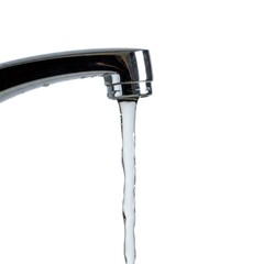 Chrome faucet pouring fresh water on white background
