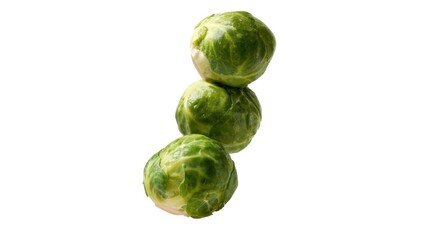 Fototapeta premium A trio of fresh, green Brussels sprouts stacked vertically, showcasing their vibrant color and texture in a simple, clean composition.