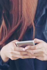 Vertical Horizon Smiling face asian woman holding smartphone with E-commerce Shopping online website Reading Online Article, Blog, vlog. Vertical Woman hands holding smart phone technology lifestyle