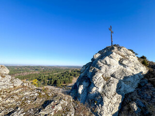 Cross on the summit of the Jurassic "little Giewont", i.e. Mount Biakło in Olsztyn Juraski near Częstochowa in Poland © rparys
