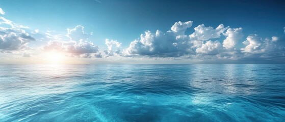 Obraz premium Serene ocean vista under a bright sky with fluffy clouds and a radiant sun casting a warm glow on the tranquil water surface creating a peaceful seascape