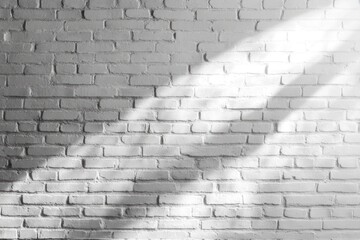 A plain white brick wall with light and shadow detail