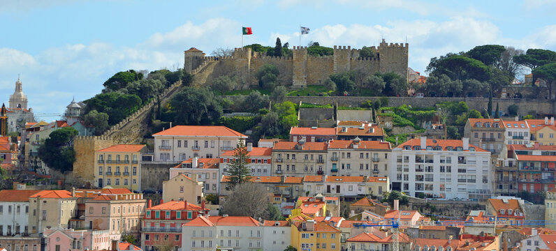 Panoramic view from the Miradouro de Sao Pedro Alcantara including Castelo de Sao Jorge, Igreja da Graca and Miradouro de Graca.Lisbon