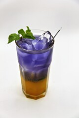 Refreshing Indonesian drink made with passion fruit and butterfly pea flower, Es Markisa Bunga Telang. Naturally vibrant with a sweet and tangy flavor, served cold with ice.
