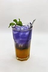 Refreshing Indonesian drink made with passion fruit and butterfly pea flower, Es Markisa Bunga Telang. Naturally vibrant with a sweet and tangy flavor, served cold with ice.