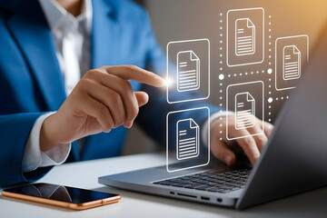 Businessman managing digital documents on laptop with virtual file interface.