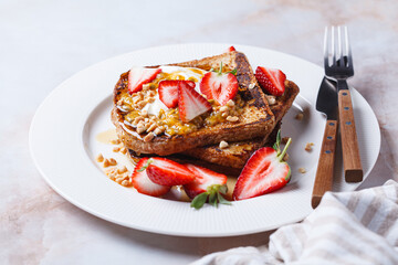 French toast with strawberries and passion fruit.