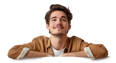 Young man leaning on white board and looking up with a smile, isolated on transparent cutout background