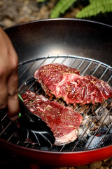 Homemade grilled steak on a grill pan. Fresh, delicious, juicy meat with copy space closeup