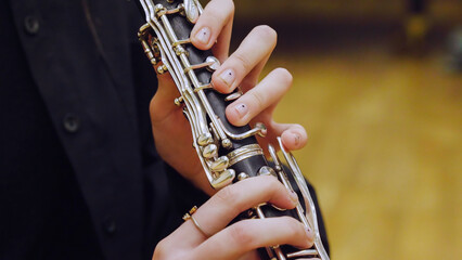 Obraz premium Musician playing clarinet during classical music concert