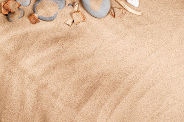 A tropical summer background featuring soft beach sand with delicate palm leaf shadows