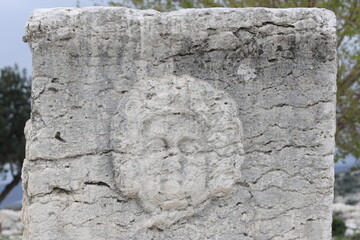 The Medusa relief is carved on the front of a stone sarcophagus in the ruins of Sakizlik in...