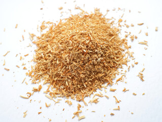 Fototapeta premium Pile of Dry Wood Shavings on a White Background Surface