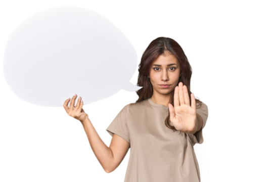 Middle Eastern woman holding comic bubble standing with outstretched hand showing stop sign, preventing you.