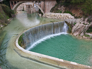 A beautiful waterfall in the historic center of Sassoferrato, Marche region, Italy