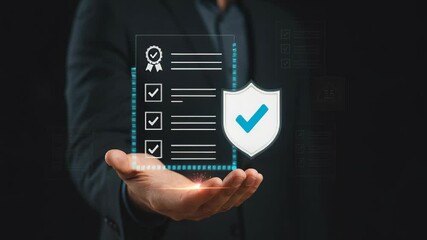 Hand presenting transparent checklist with shield icon indicating security and validation. Dark background setting enhances visual focus on document features
