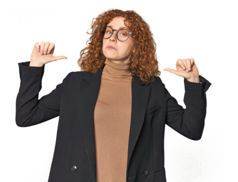 Young Caucasian redhead in business attire feels proud and self confident, example to follow.