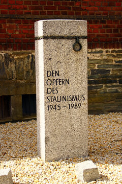 Stollberg, Germany - April 6, 2025: To the victims of Stalinism, a memorial stone in front of the former GDR women's prison in Hoheneck, Stollberg, Saxony.