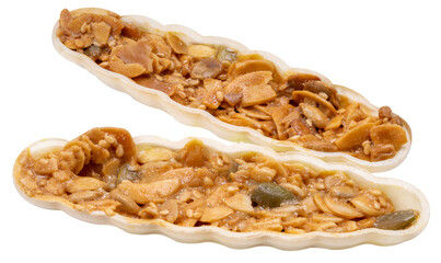Caramel peanut slices snack with almond slices, melon seeds, sesame seeds, caramel syrup, white sugar and mix nut isolate on white PNG file.