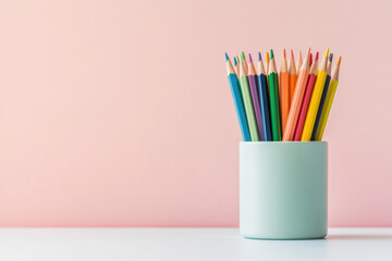 Obraz premium A modern display of colored pencils in a sleek container on a white background. This neat arrangement highlights the vibrant colors ideal for crafting and artistic endeavors.