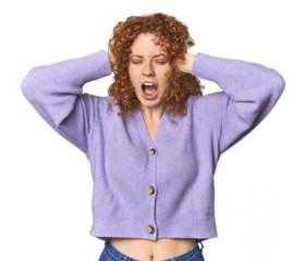 Young Caucasian redhead woman covering ears with hands trying not to hear too loud sound.