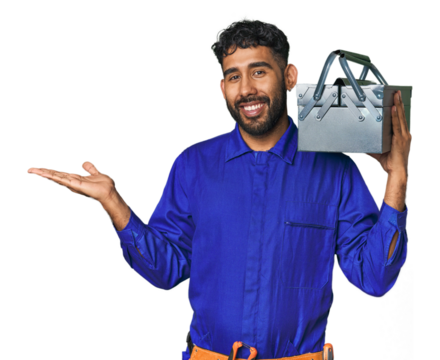 Hispanic worker with toolbox in studio showing a copy space on a palm and holding another hand on waist.