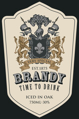 Hand-drawn banner or label for Brandy with coat of arms on an old paper background. Vector heraldic coat of arms in vintage style with lions, spears, knights helmet and fleur de lis on a shield © paseven