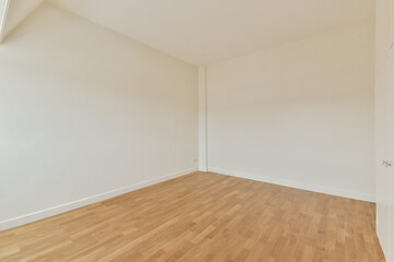 A spacious, minimalist room featuring bare walls and smooth wooden flooring, perfect for various design ideas and interior setups.