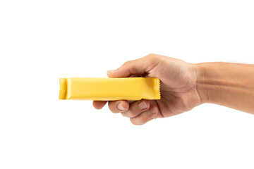 Male hand holding yellow snack bar mockup isolated no background cutout