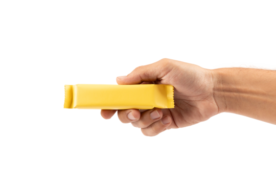 Male hand holding yellow snack bar mockup isolated no background cutout