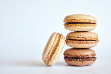 different shades of brown macaron stack on gray background