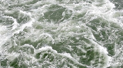 Raging water surface full of turbulent white and grey waves