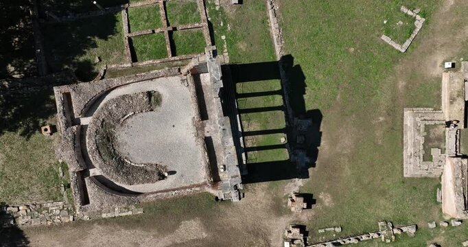 Aerial Top Down Ascending Shot Monument to Agonothetes Ruins Apollonia