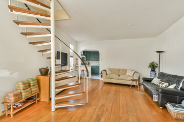 A beautifully arranged modern living space featuring a sleek spiral staircase, vibrant soft...